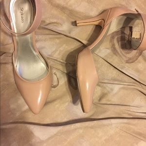 Nude 3 inch ankle strap heels.
